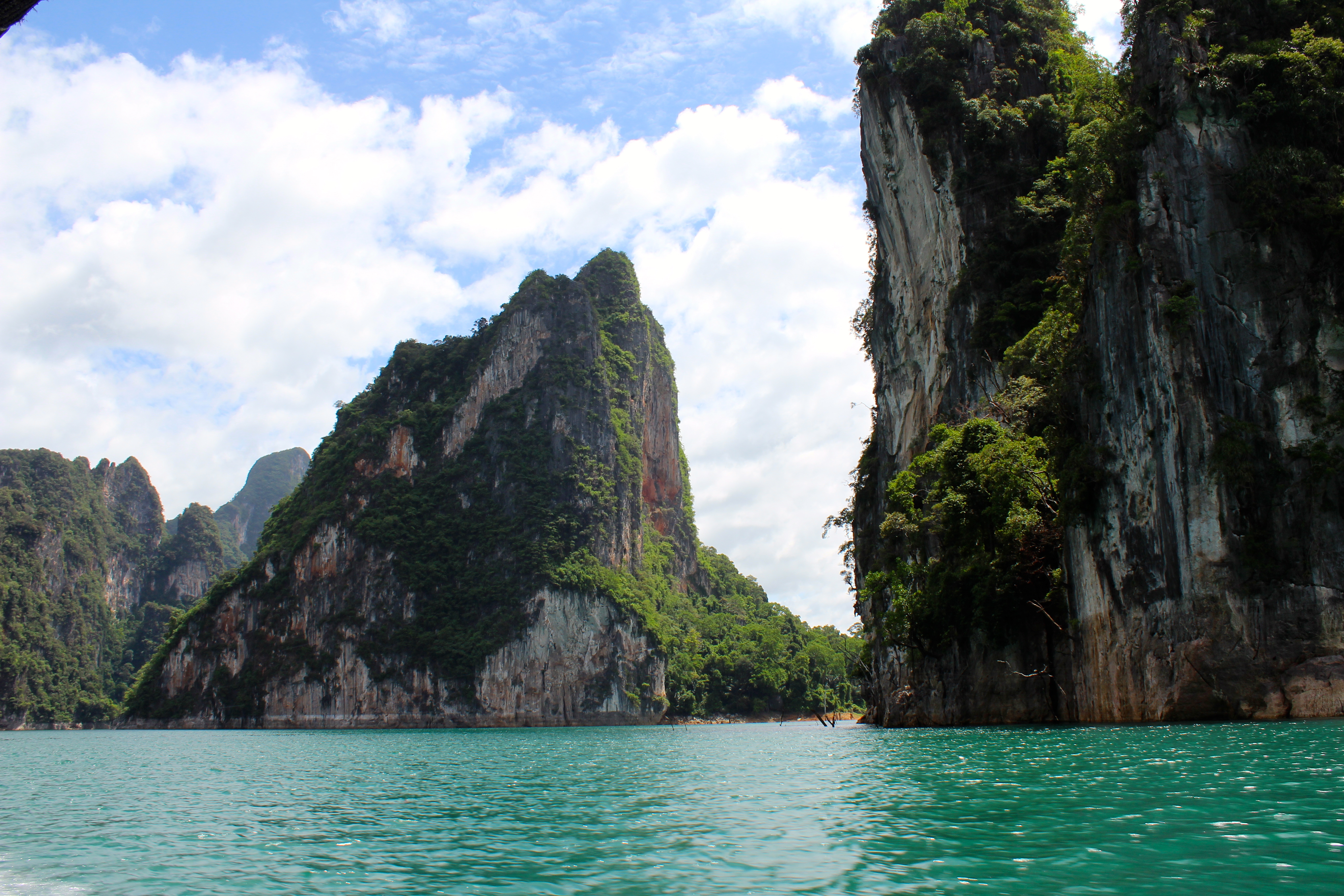 Cruising through Cheow Lan Lake, surrounded by limestone karst formations.