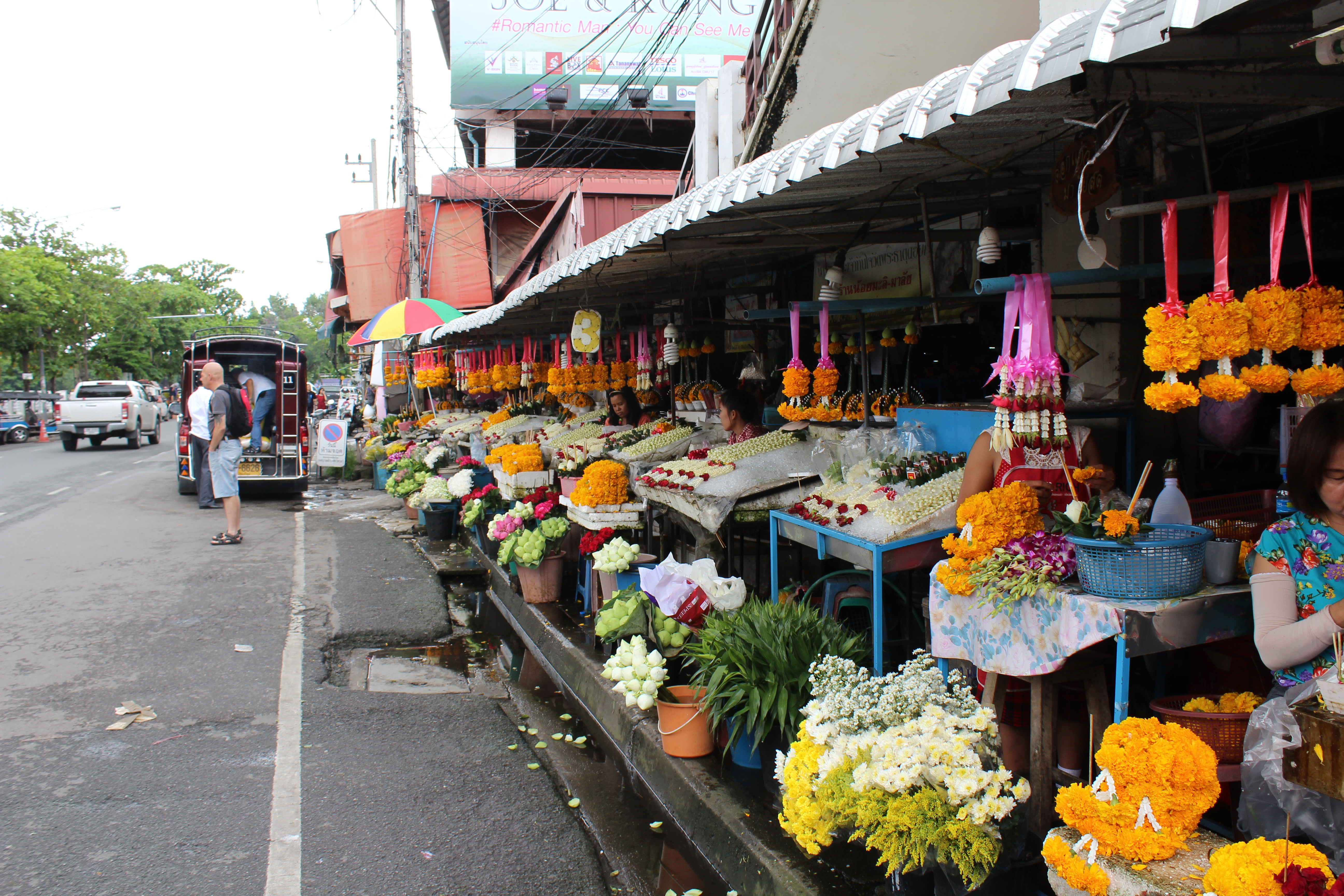 A street full of flower vendors at the Warorot Market