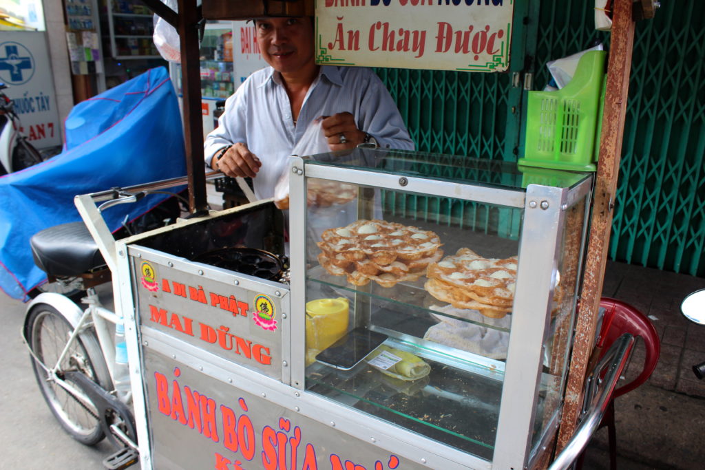 Tried banh bo sua nuong for about 25 cents from this super friendly street vendor!