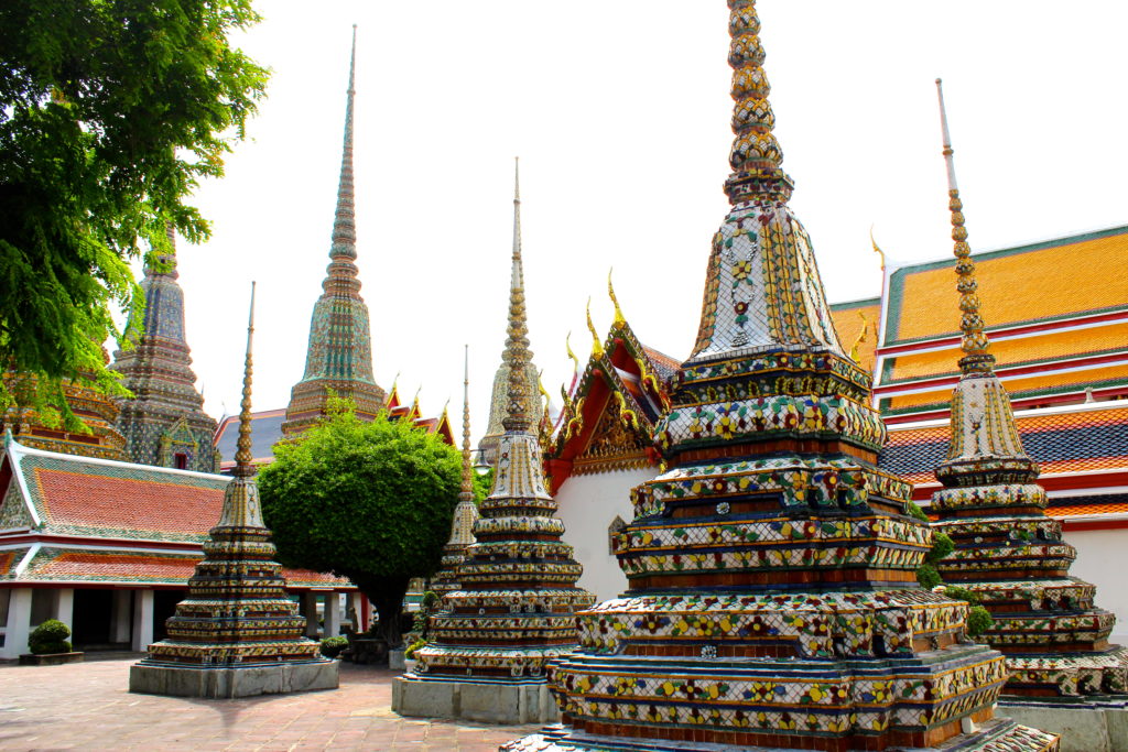 You will find beautifully ornate details surrounding the Wat Pho temple complex.