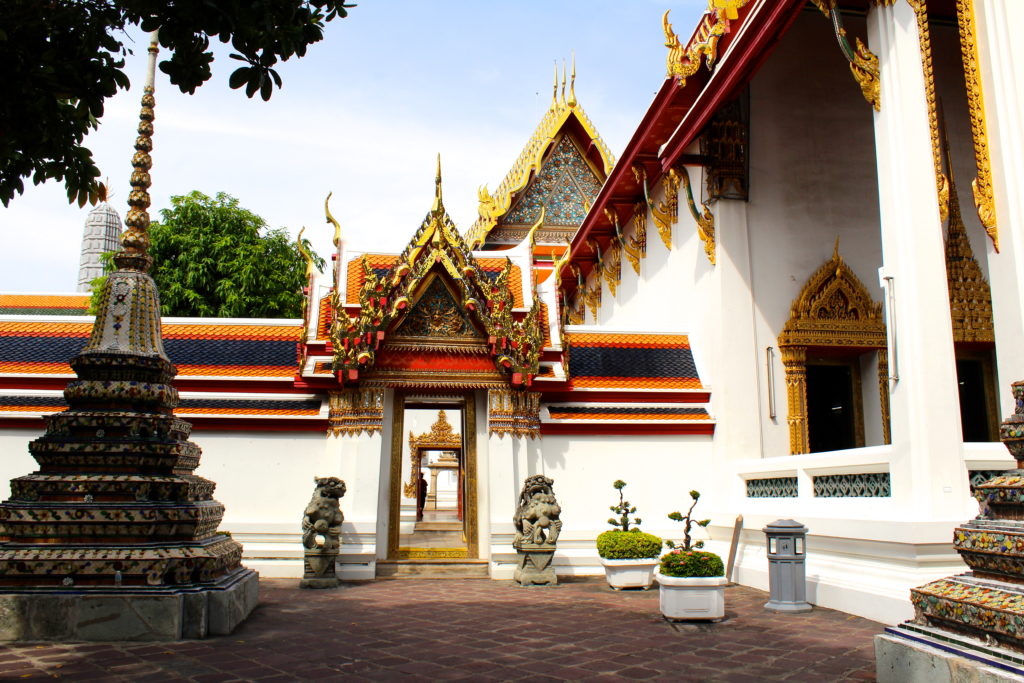 You will find beautifully ornate details surrounding the Wat Pho temple complex.