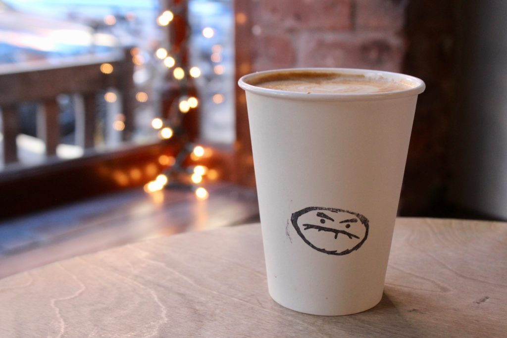 Cafe Grumpy serves up a top notch soy latte with the cutest little grumpy face logo.