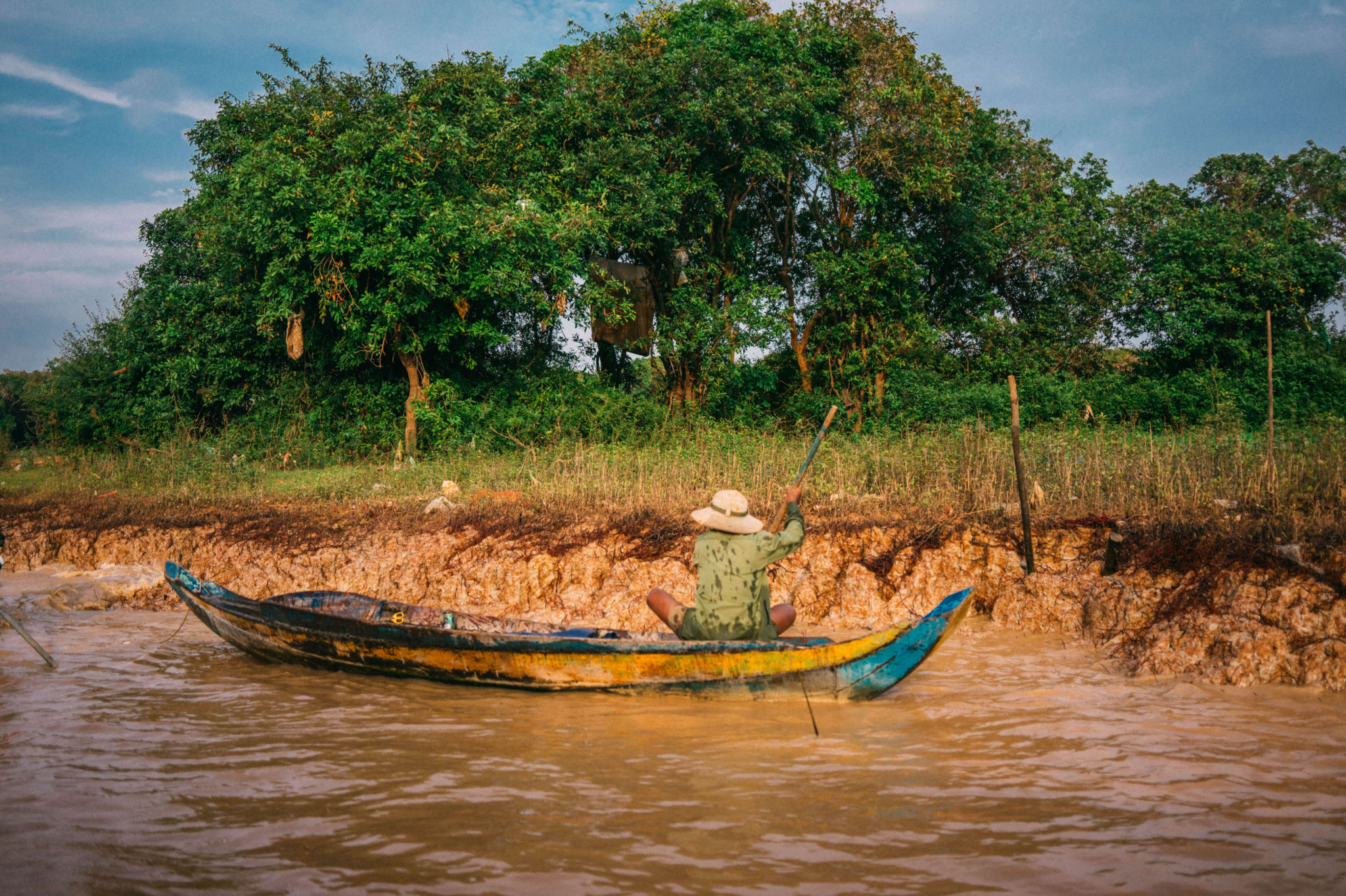 Floating Village of Chong Khneas, Chong Kneas, Floating Village, Siem Reap, Tonle Sap Lake, Cambodia, floating houses, house boat, southeast asia, man on small boat, man on small fishing boat, cambodian man fishing